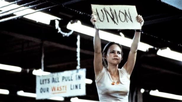 In a non-union textile mill, a union organizer leads workers in a protest.