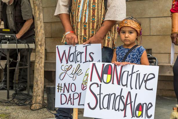 Native American mother and child protesting