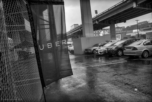cars parked at Uber sign