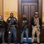 Armed protestors inside Michigan legislature.