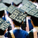 student graduation caps with debt protest
