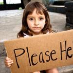 young girl holding cardboard sign "Please Help"
