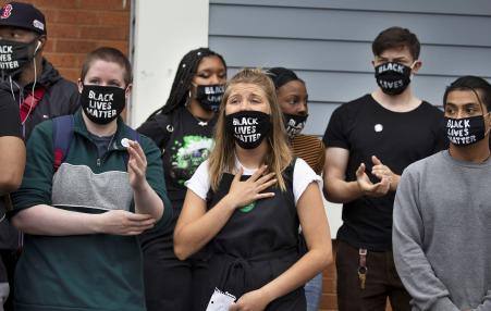 Eight protesters wearing Black Lives Matter Masks 