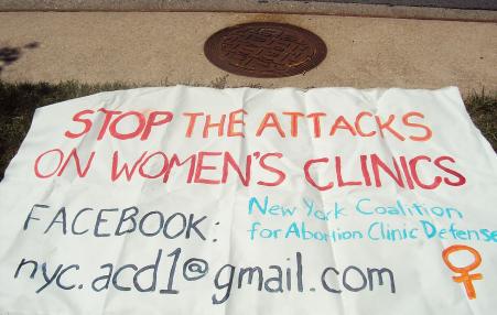 banner to stop violence against women's clinics