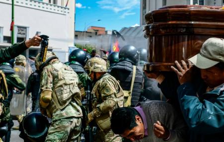 police attacking funeral in Bolivia