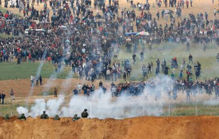 Paelstinian demonstrators under Israel attack