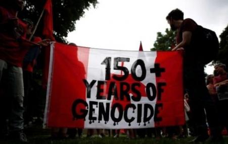 Banner "150 years+ Genocide"